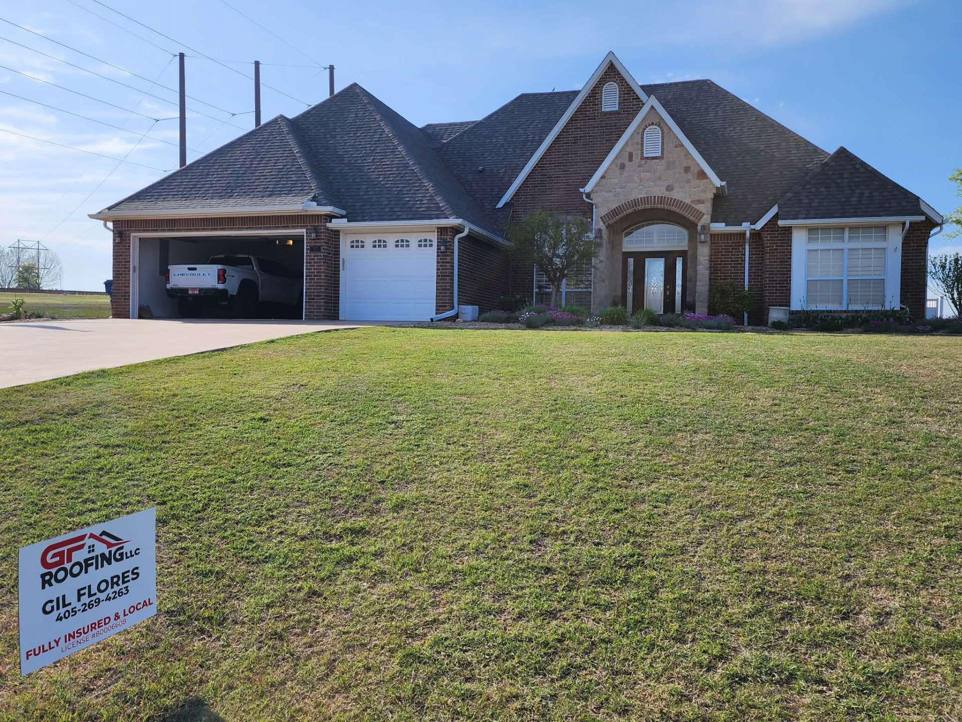 Completed roof replacement with GF Roofing yard sign — Oklahoma home