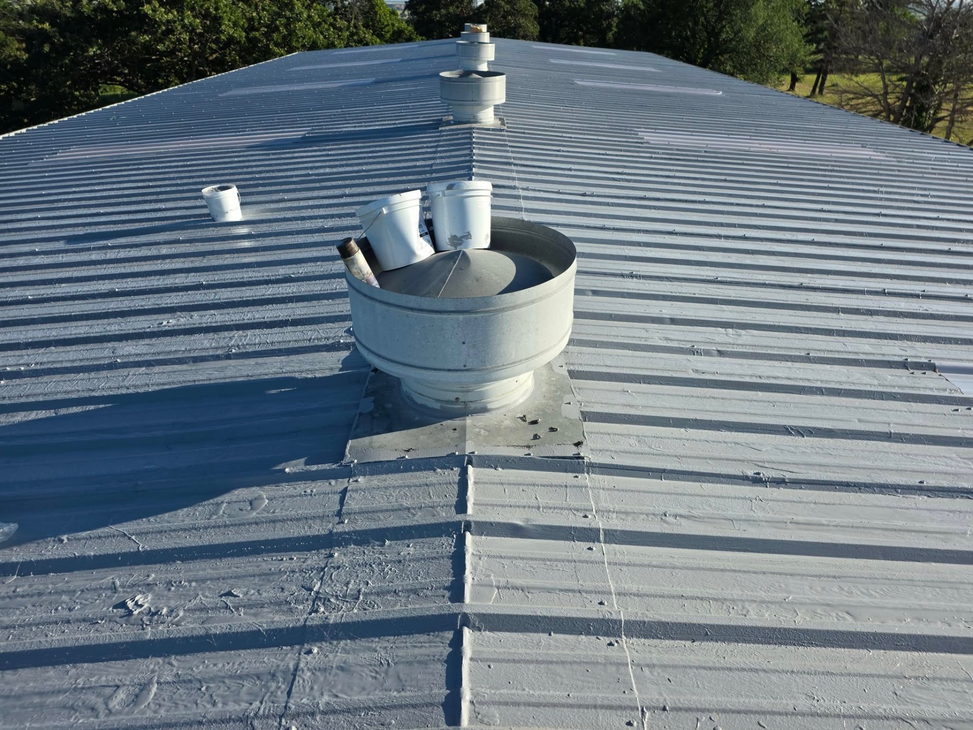 Metal roof restoration with fresh elastomeric coating