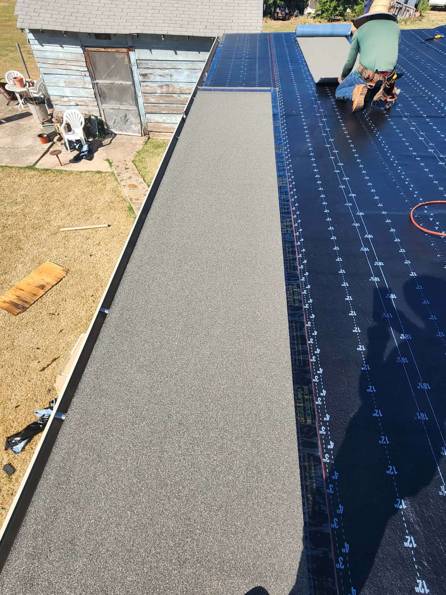 Modified bitumen flat roof installation in progress